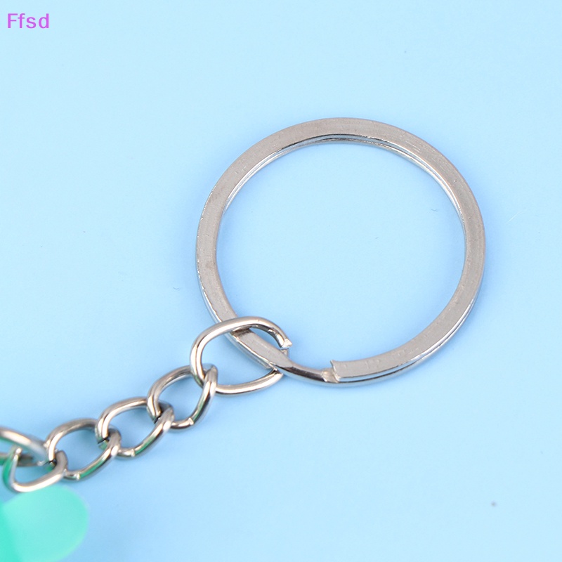 1 Móc Khóa Dạ Quang Hình Búp Bê Hoạt Hình Sáng Tạo