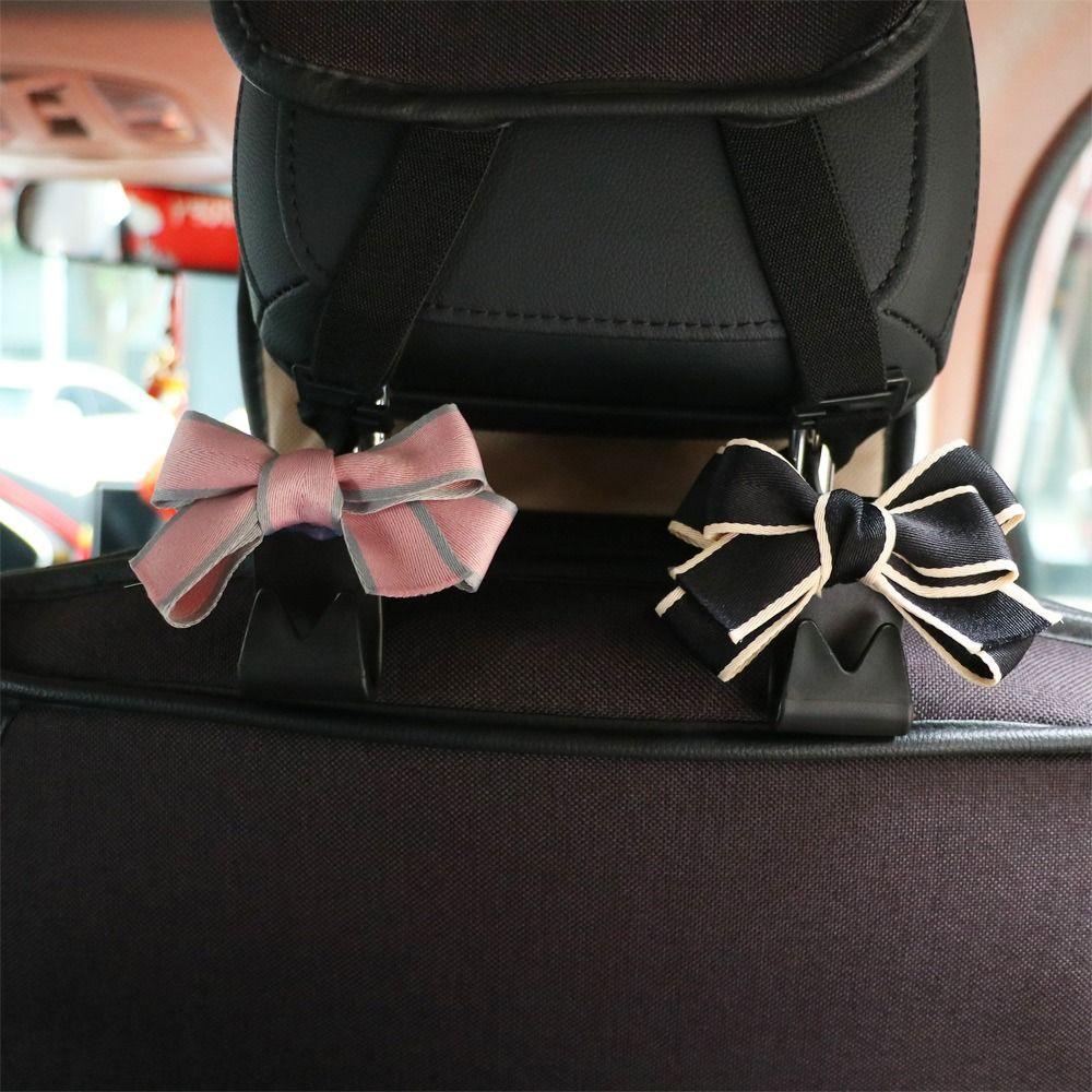 Móc Treo Đồ Gắn Lưng Ghế Xe Hơi Hình Nơ Bằng Nhựa Đa Năng Tiện Dụng