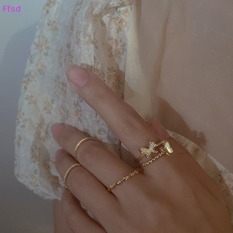 Bộ 4 Nhẫn Hình Bướm Tròn Màu Bạc Thời Trang Có Thể Điều Chỉnh Cho Nữ