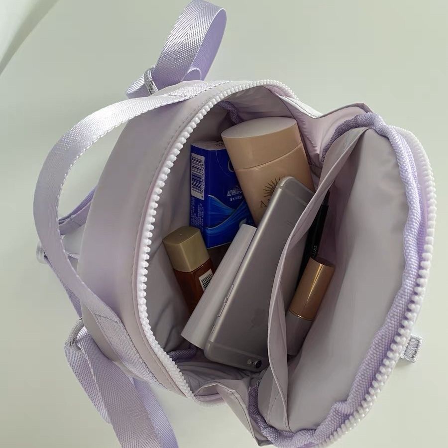 Túi Đeo Chéo Dây Rút Dáng Tròn Nhỏ Vải Nilon Màu Tím Thời Trang Cao Cấp