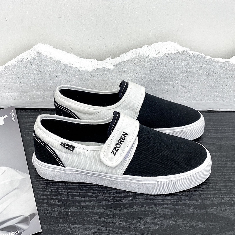 Mùa xuân phong cách mới phong cách chung màu đen trắng slip-on velcro low-top giày nam giày nữ đôi phong cách sinh viên vải sne