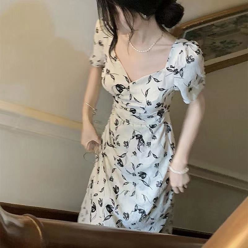 Váy hoa nơ tay ngắn hở lưng Đầm cổ chữ V rỗng ra lưng phong cách Pháp nữ tính khí Váy dài trung bình mùa hè