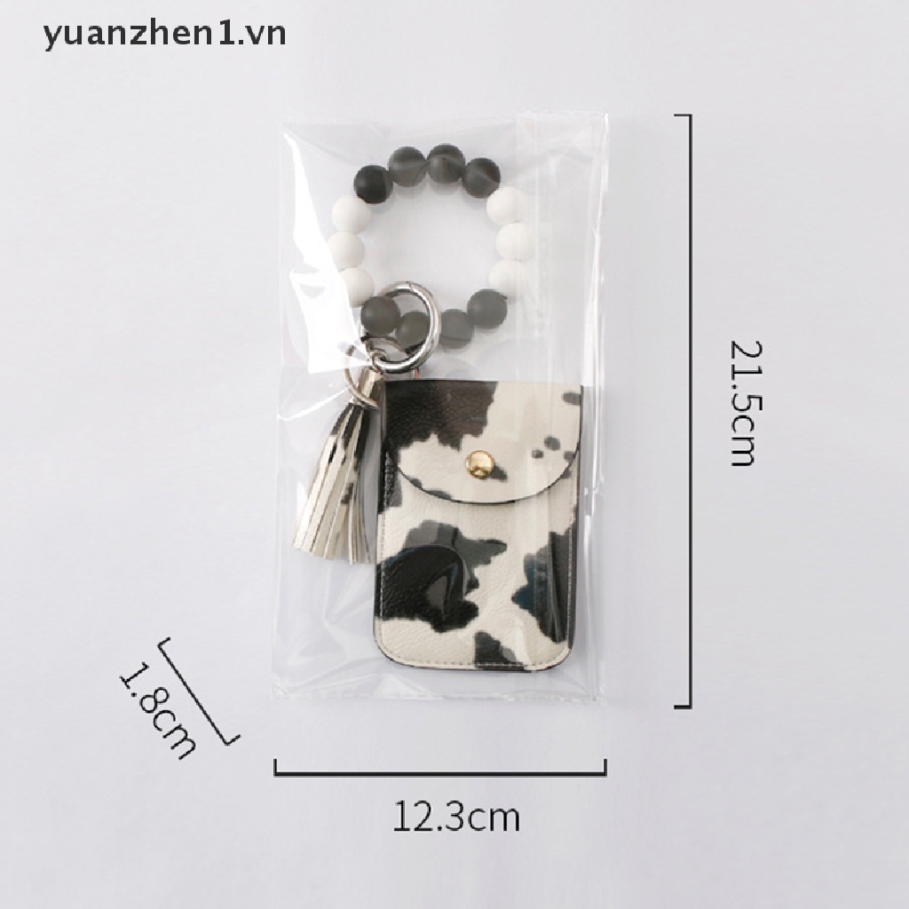 Móc Khóa Dạng Ví Đính Hạt Phối Dây Tua Rua Và Dây Đeo Tay Bằng Silicon
