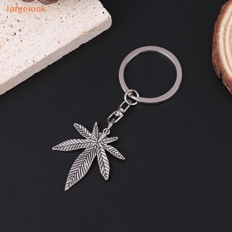 Móc Khóa Kim Loại Hình Lá Phong Màu Bạc Thời Trang