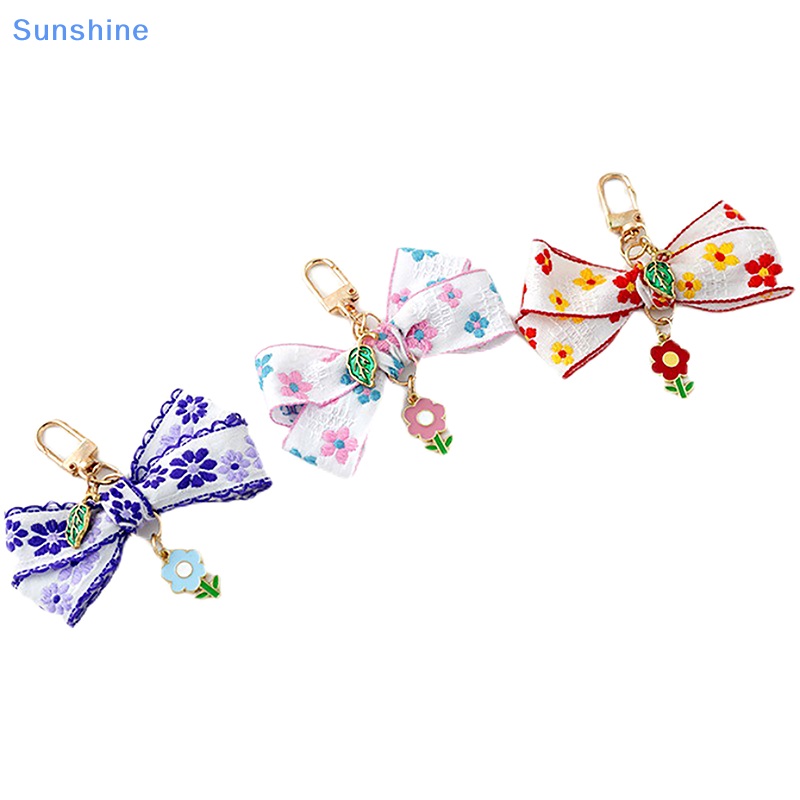 1 Móc Khóa Hình Hoa Hướng Dương Thắt Nơ Ruy Băng Đáng Yêu