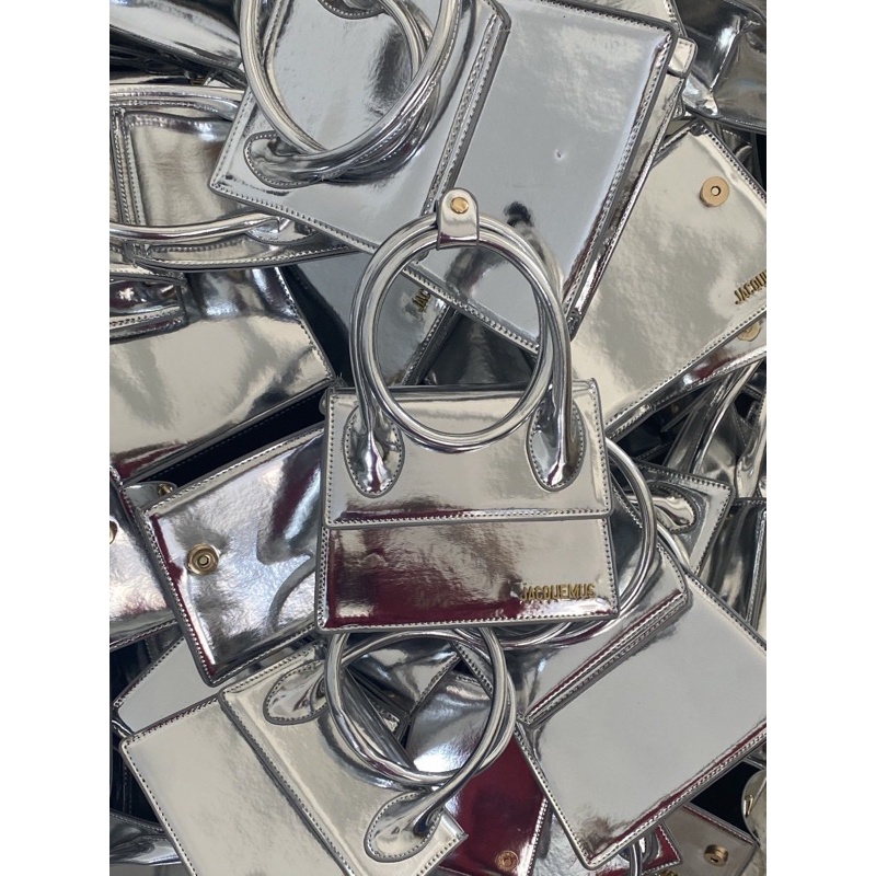 Túi xách nữ Jac cầm tay bạc tráng gương sang chảnh có dây đeo chéo.