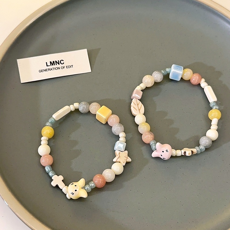 Vòng Tay Chuỗi Hạt Gốm Nhiều Màu Đính Hình Thỏ / Lá / Thánh Giá / Ngôi Sao Phong