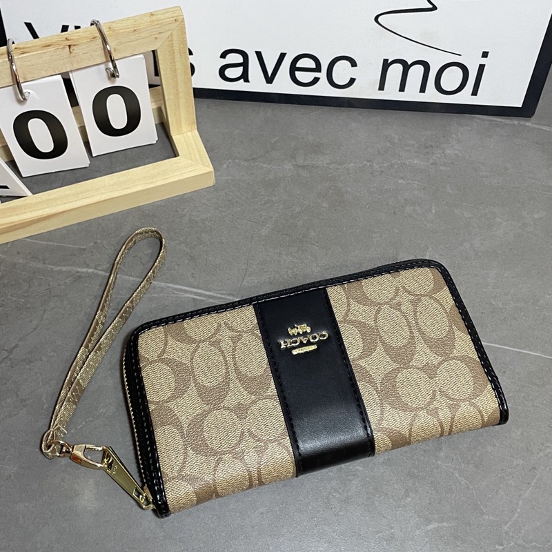 Ví Da Cầm Tay Màu Đen Cho Nam Và Nữ coach4140 k