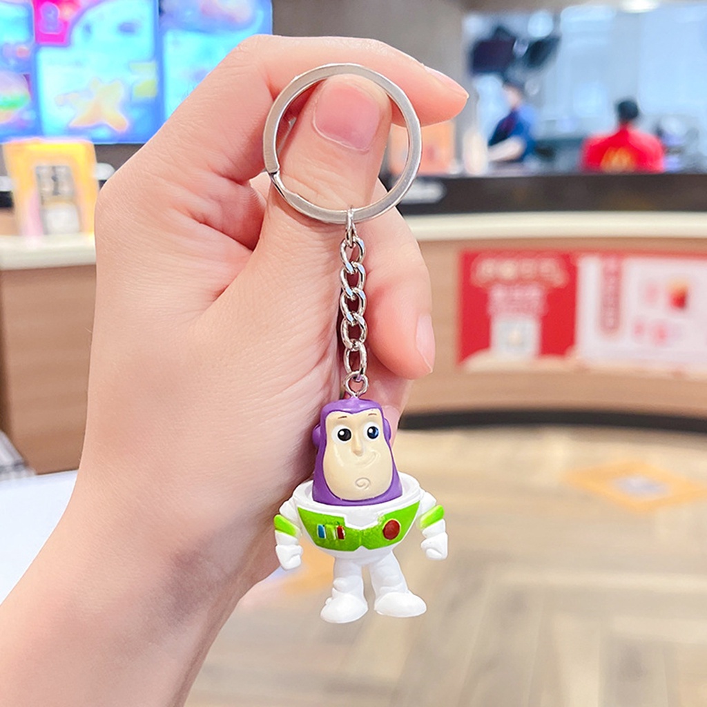 Câu chuyện đồ chơi mới buzz lightyear strawberry bear three-eyed boy bag phụ kiện phim hoạt hình xe hơi móc khóa