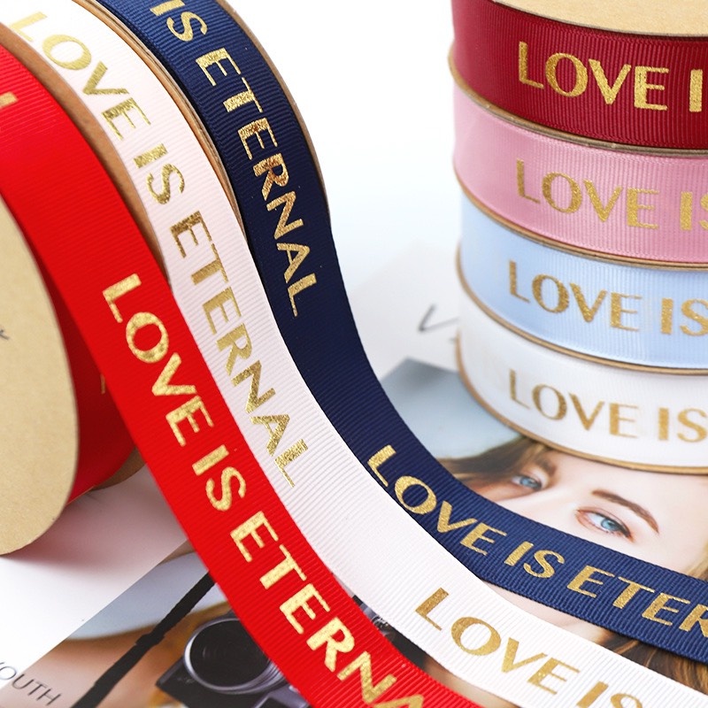 Ruy băng lụa gói quà và hoa in chữ bản 2,5cm dài 35m