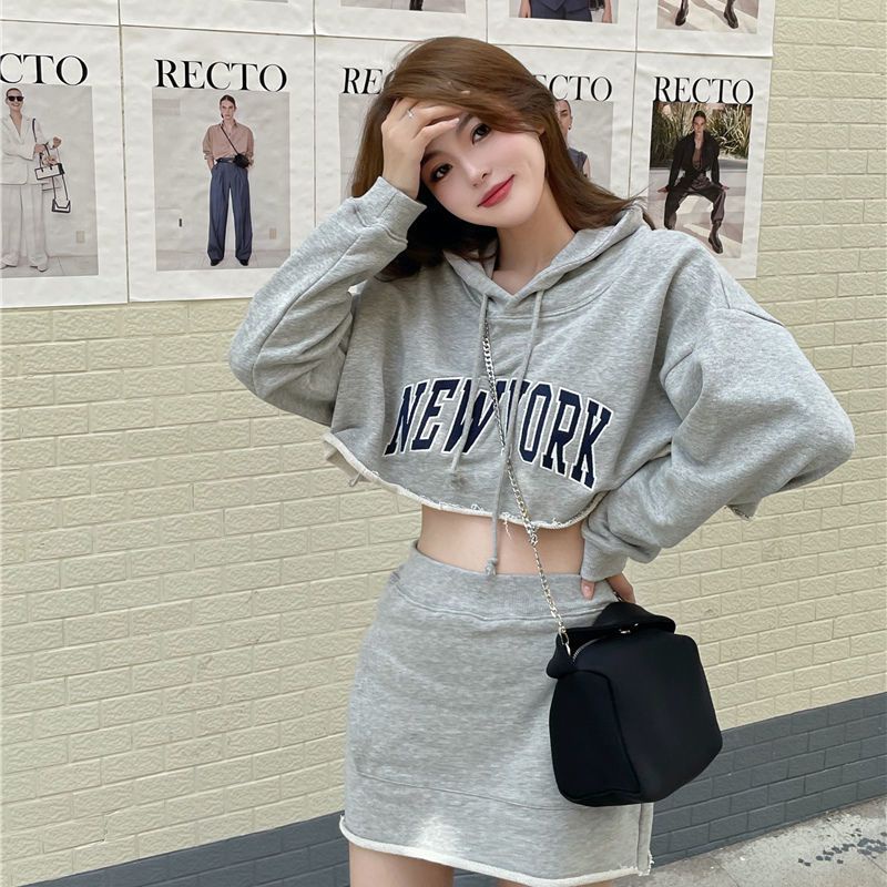 New hot girl short hooded long sleeve knitted suit loose letter printed sweater hip-covered skirt casual sports two-piece set