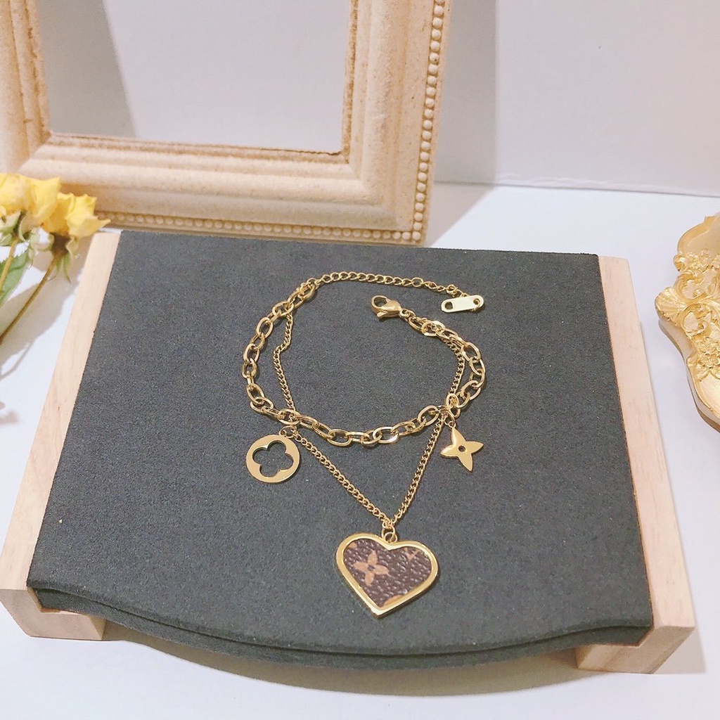 Vòng Tay louis vuitton Bằng Thép Titan Khắc Chữ lv monogram