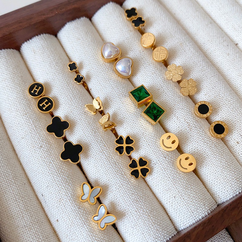 Khuyên Tai Xoắn Ốc Bằng Thép Titan Không Phai Màu Hình Cỏ Bốn Lá Đơn Giản Thời Trang