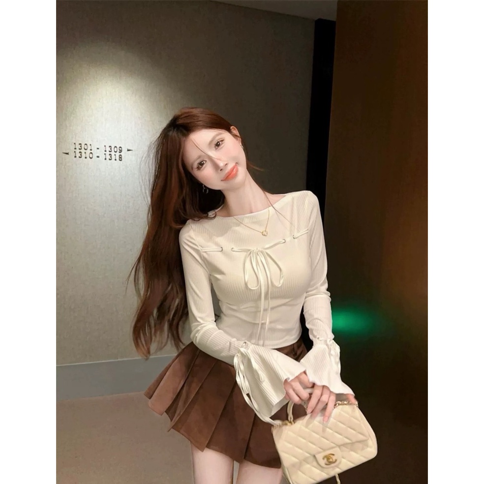 Set áo trắng cột nơ tay loe+chân váy xếp ly nâu