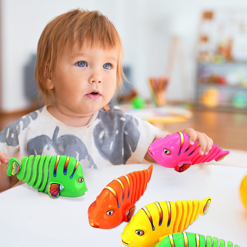 Đồ Chơi Lên Dây Cót Hình Cá Xoay Tròn Không Có Bóng Và Bền