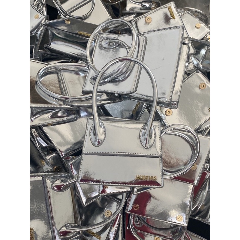 Túi xách nữ Jac cầm tay bạc tráng gương sang chảnh có dây đeo chéo.