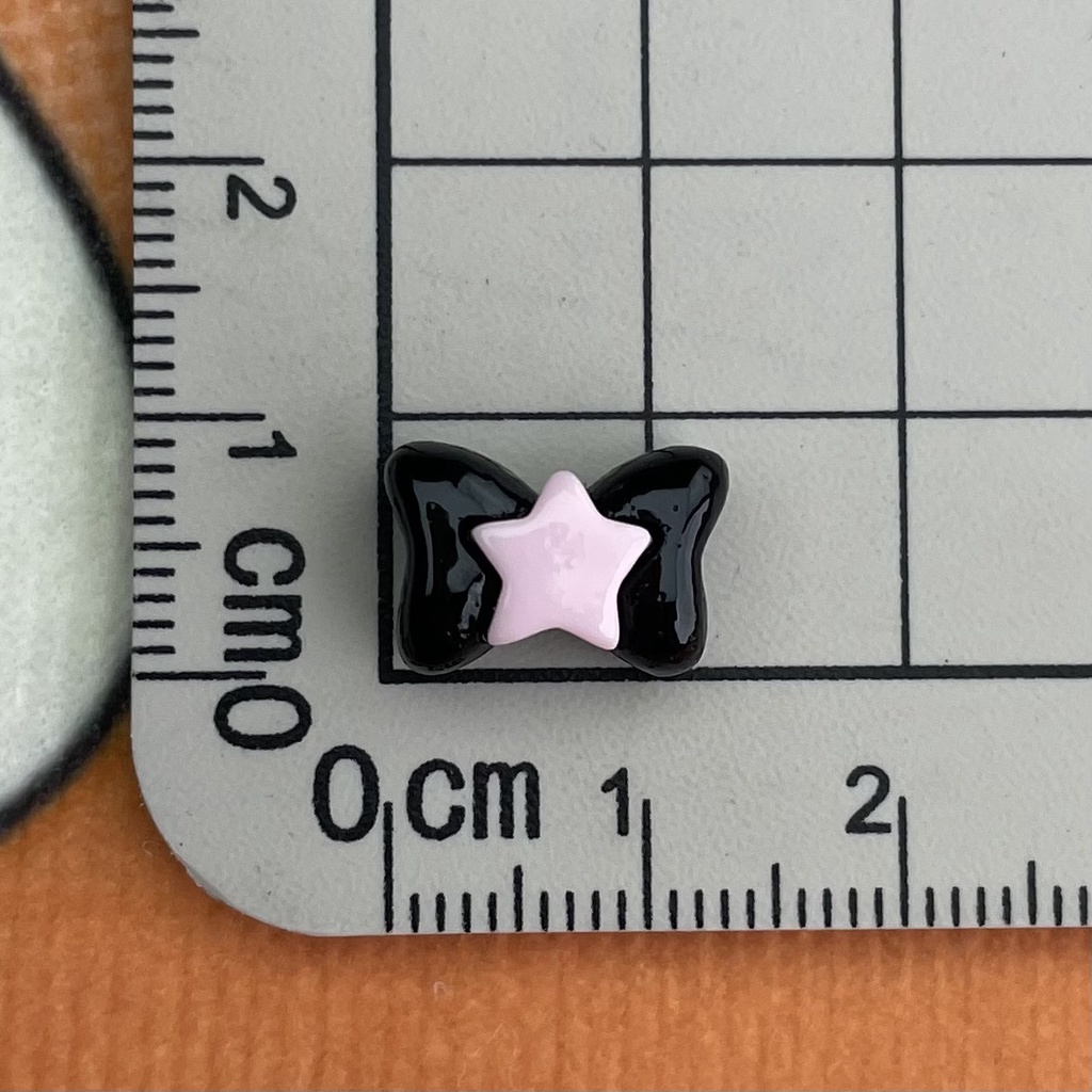 Set 10 Phụ Kiện Trang Trí Điện Thoại Hình Chiếc Nơ / Ngôi Sao Màu Đen Bằng Nhựa resin