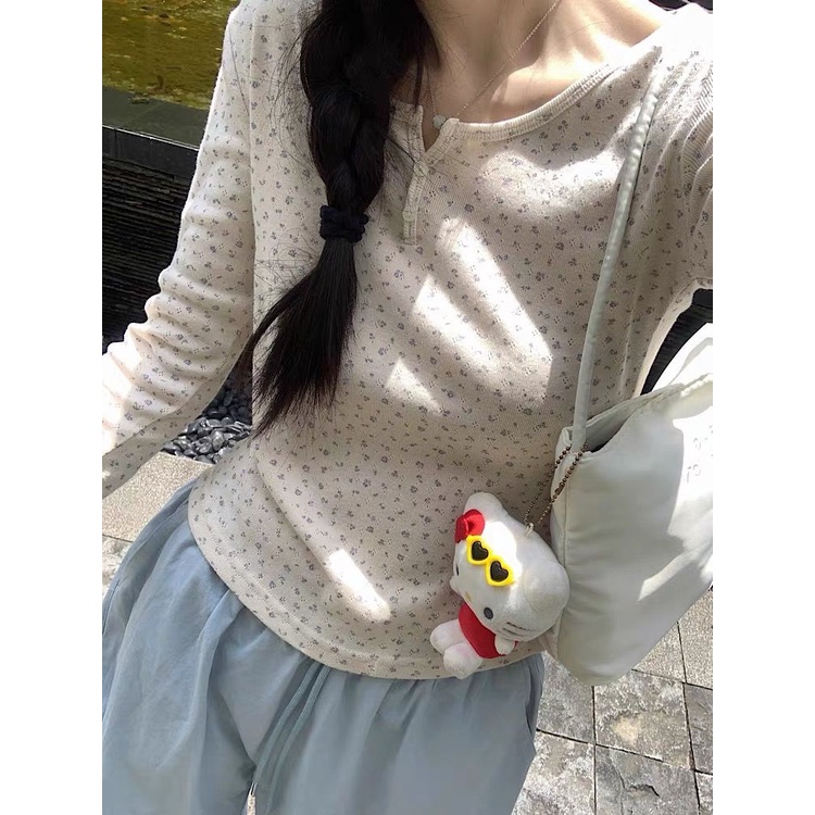 Áo Thun Nữ Tay Dài Cổ Tròn Cài Nút Họa Tiết Hoa Thời Trang Mới