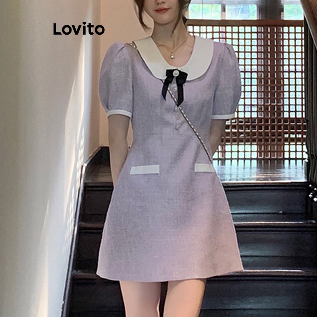 Đầm Lovito tay phồng cổ tương phản đính nơ phối túi giả màu trơn thường ngày cho nữ LNA17158 (Màu tím)