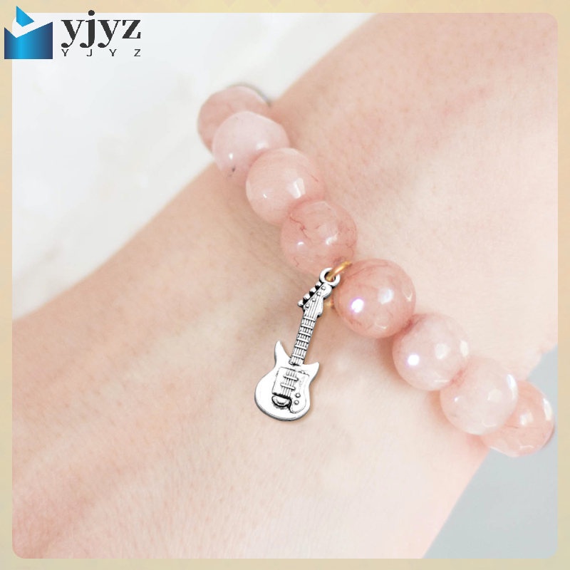 Set 20 Miếng Gảy Đàn Ghita Kèm Giá Đỡ Đeo Tay Trang Sức Dành Cho Nam