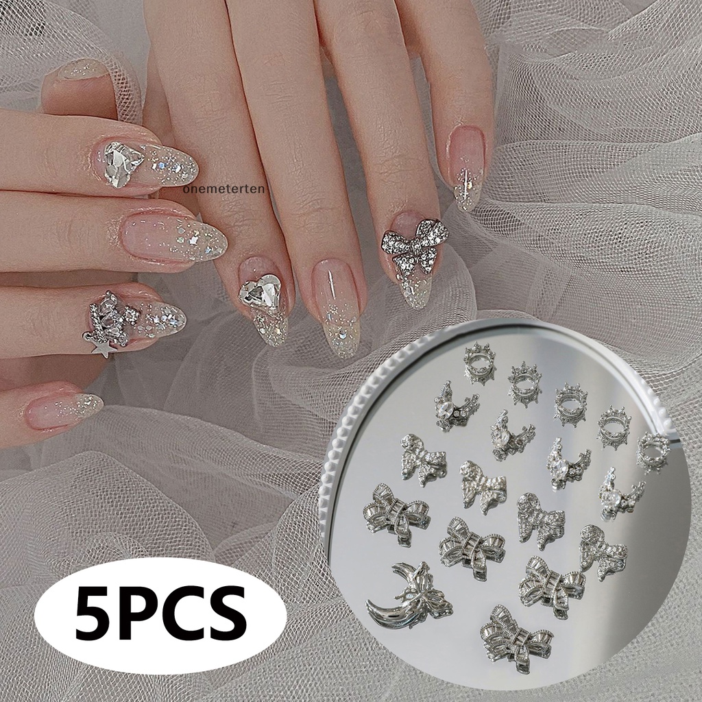 Rten Set 5 Phụ Kiện Trang Trí Móng Tay Nghệ Thuật Bằng Hợp Kim Hình Nơ 3d Màu Bạc Đính Đá Quý Nhân Tạo n