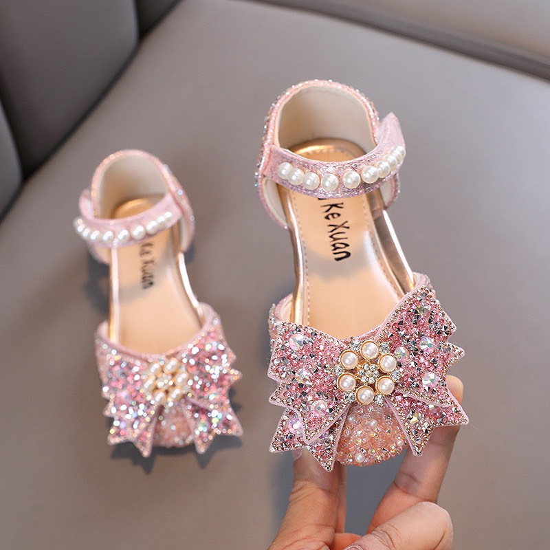 Giày sandal búp bê bé gái - Giày bệt công chúa cho bé găn nơ đính ngọc kết hoa và có kim sa lấp lánh cao cấp mã 858 11