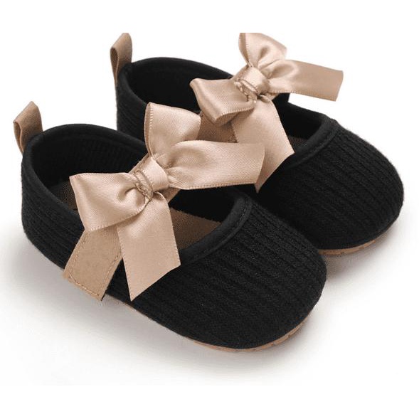 Búp Bê Tập Đi Đen Đính Nơ Hồng