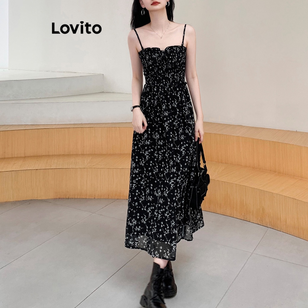 Đầm Lovito xẻ tà buộc dây dún thun hoa nhí thường ngày cho nữ LNE19050 (Màu đen)