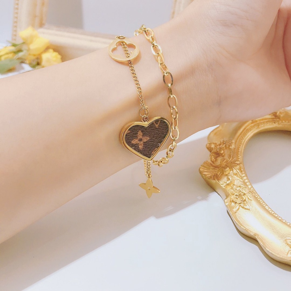 Vòng Tay louis vuitton Bằng Thép Titan Khắc Chữ lv monogram