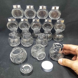 Hũ thủy tinh nhỏ 50ml mẫu Tròn Dẹt kiểu Nghiêng - nắp nhựa màu bạc