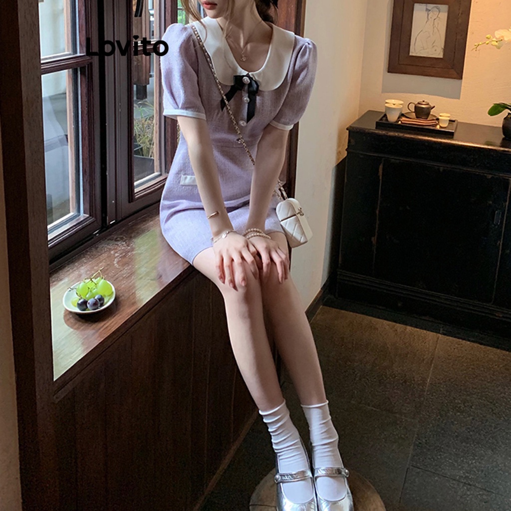 Đầm Lovito tay phồng cổ tương phản đính nơ phối túi giả màu trơn thường ngày cho nữ LNA17158