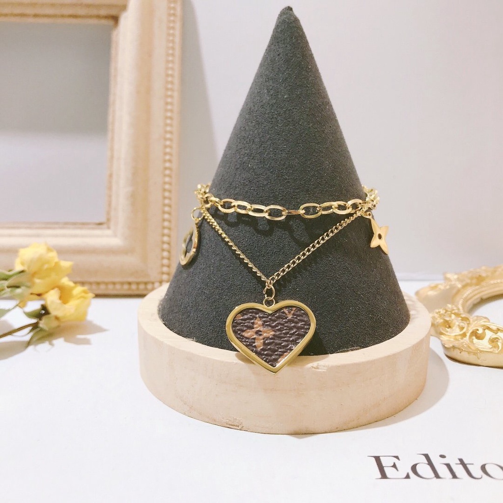 Vòng Tay louis vuitton Bằng Thép Titan Khắc Chữ lv monogram