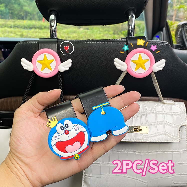 Bộ 2 Móc Treo Đồ Gắn Sau Ghế Xe Hơi Đa Năng Hình doraemon / melody / Cậu Bé Bút Chìa Khóa