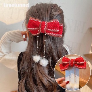 Kẹp tóc nơ tua rua màu đỏ mừng năm mới cho bé gái