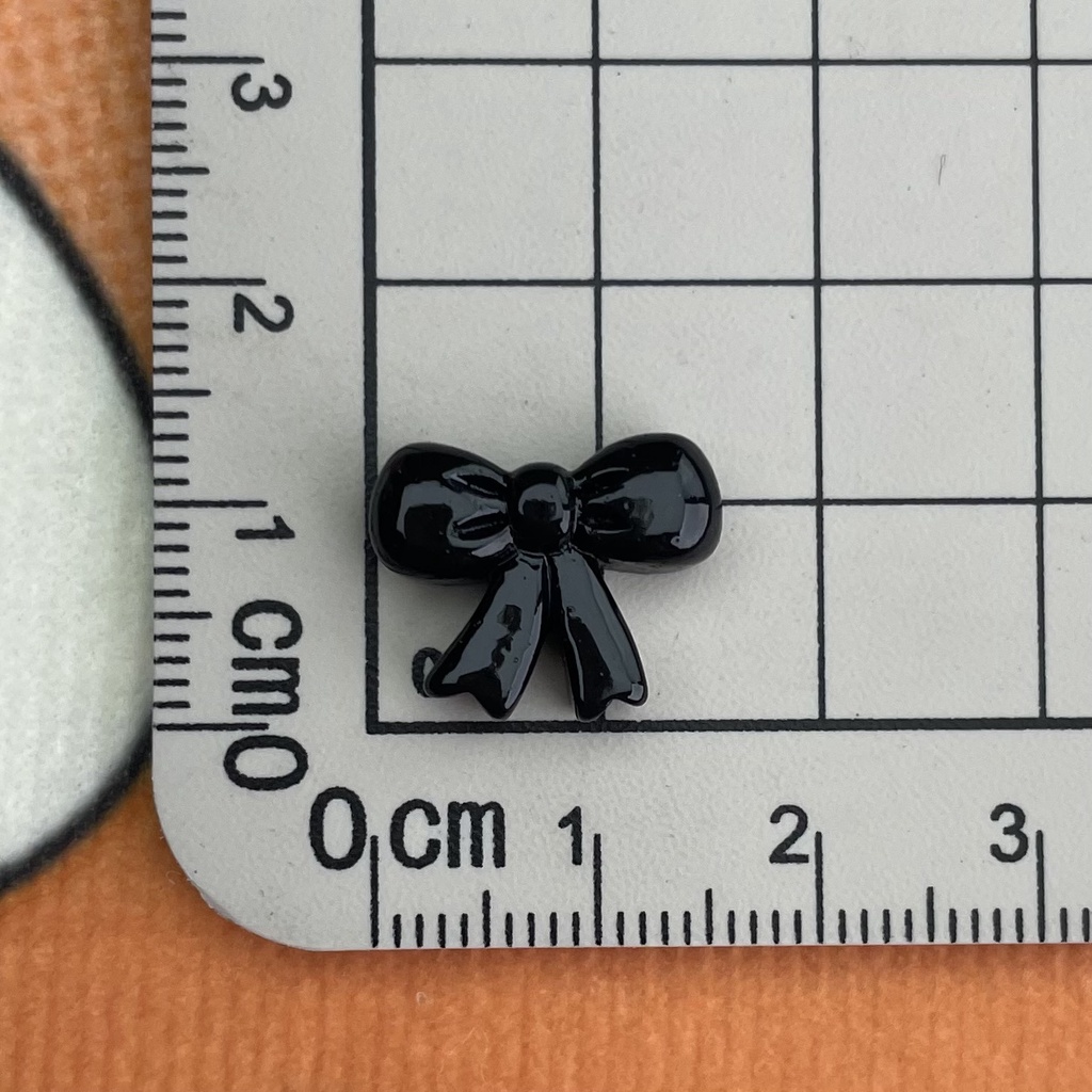 Set 10 Phụ Kiện Trang Trí Điện Thoại Hình Chiếc Nơ / Ngôi Sao Màu Đen Bằng Nhựa resin