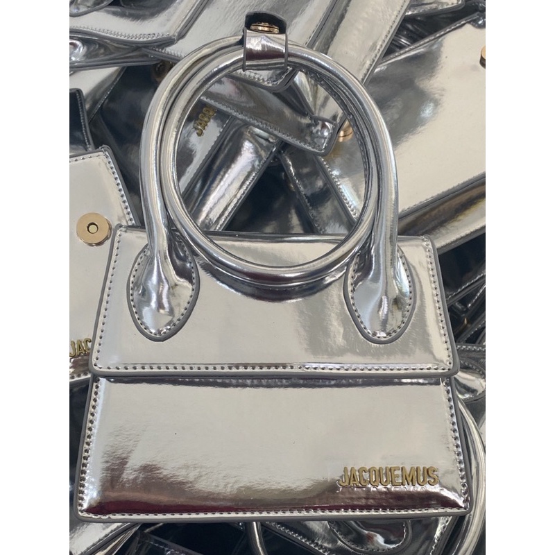 Túi xách nữ Jac cầm tay bạc tráng gương sang chảnh có dây đeo chéo.
