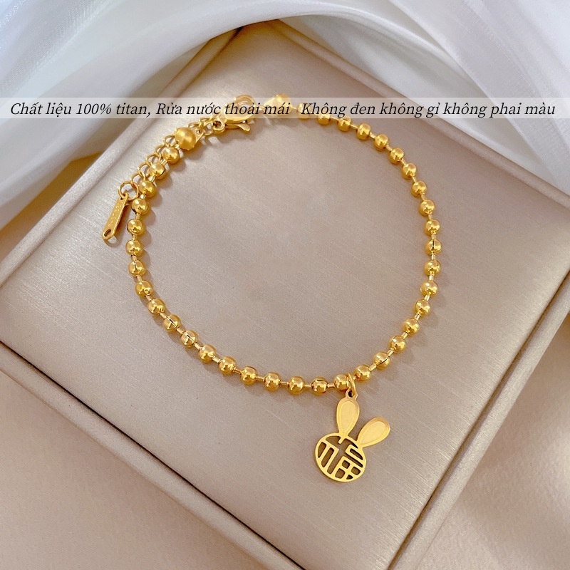 Vòng tay titan không gỉ dạng bi tròn mạ vàng 18k thiết kế mặt chữ phúc hình tai thỏ dễ thương dành cho nữ