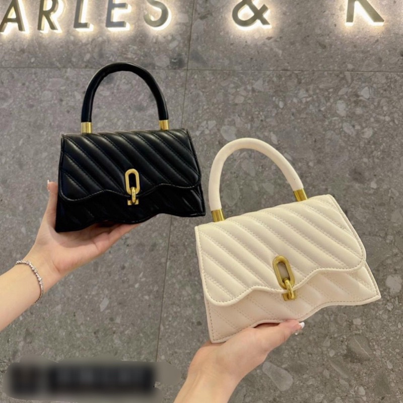 Túi xách nữ đeo chéo da mềm trần chéo khoá móc đế lượn sóng có quai xách cầm tay mẫu mới 2023