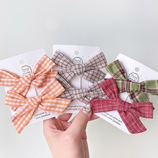 Set 2 kẹp tóc nơ sọc caro cho bé gái