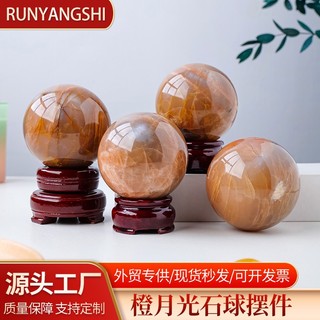 Quả cầu pha lê đá mặt trăng màu cam tự nhiên dùng trang trí bàn
