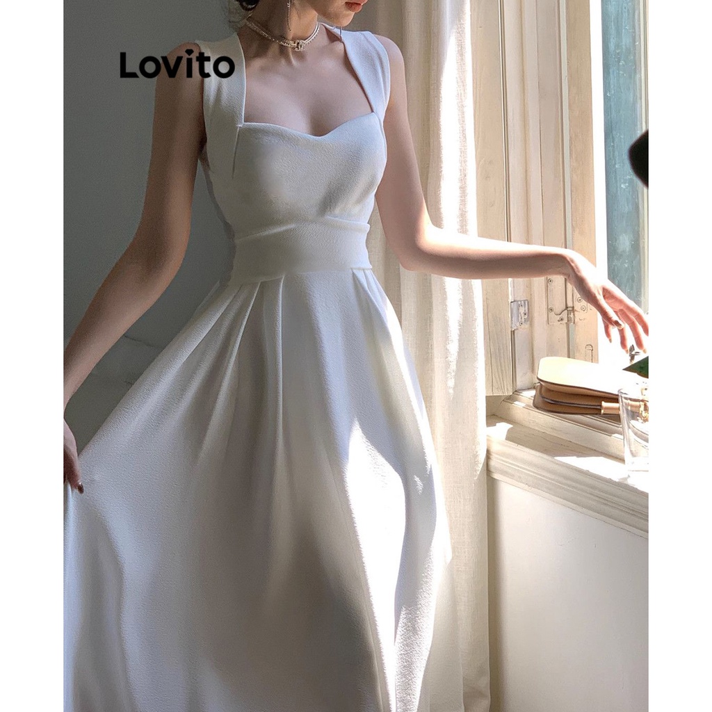Đầm Lovito phối dây chéo cột nơ lưng màu trơn thường ngày cho nữ LNA19217 (màu trắng ngà)