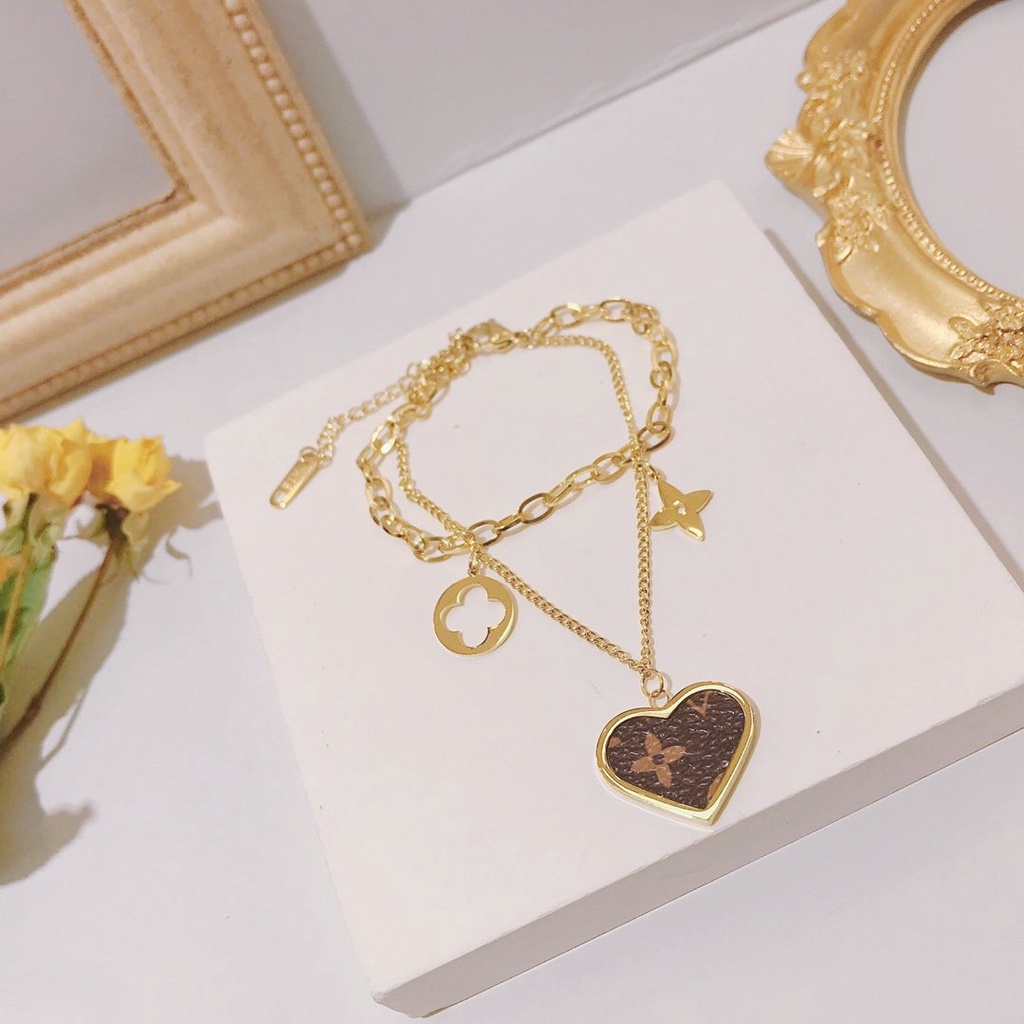 Vòng Tay louis vuitton Bằng Thép Titan Khắc Chữ lv monogram