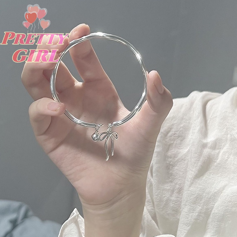 Vòng Tay Hở Mặt Hình Nơ Đơn Giản Nhẹ Nhàng Với Chuông Trang Sức Đi Tiệc