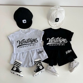 Bộ đồ ngắn tay Cotton bé trai và bé gái 2024 Áo thun in chữ thời trang mới + Quần Short nước ngoài Bộ hai mảnh