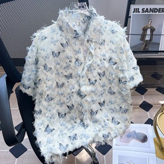 Nam 2024 mùa hè mới của Mỹ thời trang đường phố dáng rộng phiên bản Hàn Quốc thiết kế tua rua vui nhộn họa tiết bướm hoạt hình thương hiệu thời trang hoa Thái Lan Áo sơ mi ngắn tay đi biển Hawaii.