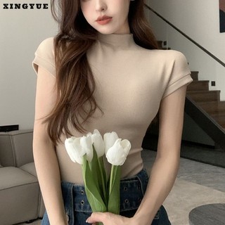 Xingyue Áo thun phong cách Hàn Quốc gợi cảm nửa trắng cổ cao cổ vai phải áo thun ngắn tay mỏng mùa hè eo bó sát ngắn hot girl top
