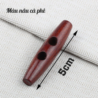Nút gỗ dài 5cm 2 lỗ màu nâu dùng trang trí áo, túi xách, nón