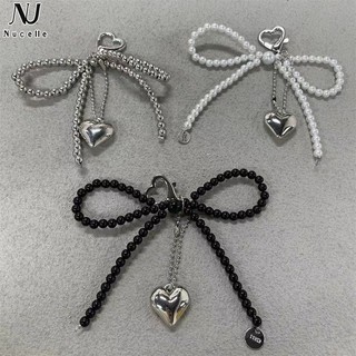 Nucelle Ngọc trai mới cao cấp khí chất nơ túi mặt dây chuyền cổ tích ngọt ngào ngọc trai nơ chìa khóa phụ kiện
