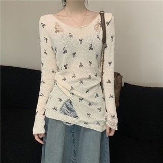 Áo dệt kim dài tay in hình nơ rỗng dành cho nữ Mùa hè Phong cách mới lệch vai Ri