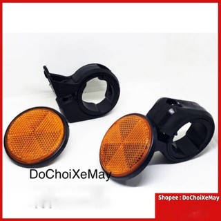 Mắt mèo phản quang bắt phuộc trước cho mọi loại xe . DoChoiXeMay